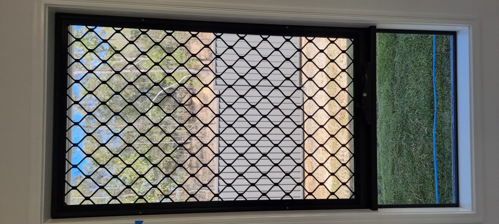 Barrier window screen close-up showing aluminium mesh detail