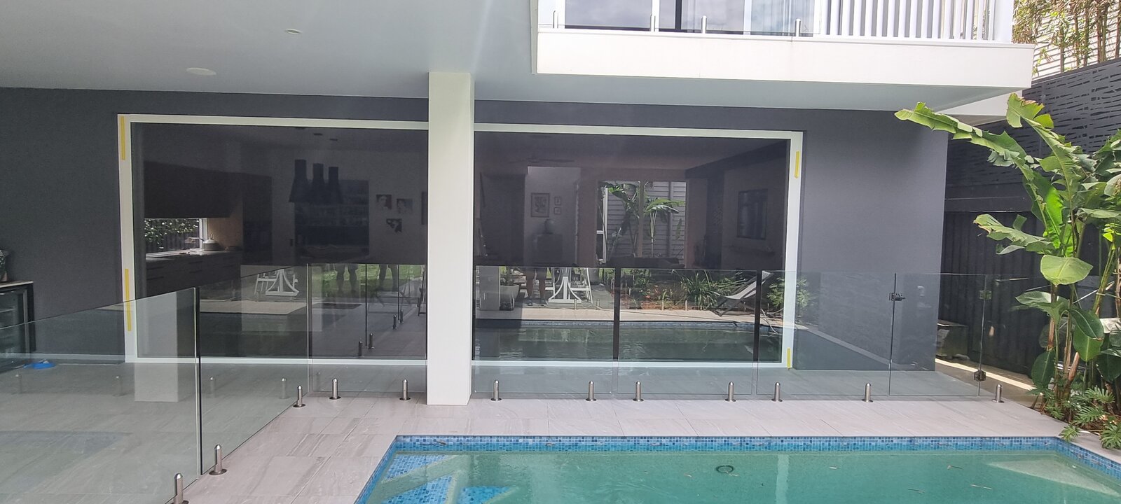 Retractable door screen installation on Gold Coast home